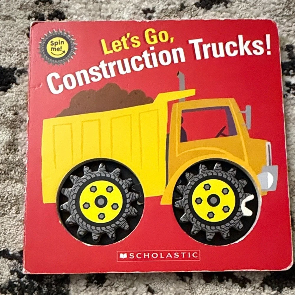 Scholastic Let's Go, Construction Trucks! Board Book - Yellow Truck on Red Cover